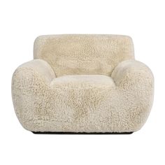 a white chair that is made out of sheepskin