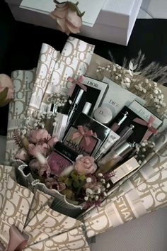 a basket filled with lots of different types of cosmetics and makeup products on top of a table