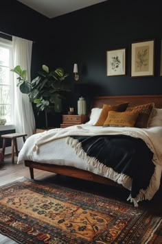 a bedroom with black walls and rugs on the floor next to a large bed