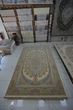 a large area rug in the middle of a room filled with carpet and other items