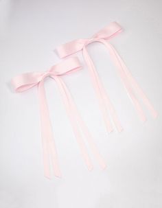 Style the coquette trend with these pastel hair bows. These trending bows feature a pink satin fabric and alligator clip on the back, perfect for versatile styling. Material: Fabric Dimensions: Length 26cm x Width 16cm | Lovisa Pink Fabric Wide Skinny Hair Bow Pack Pink Hair Bow Aesthetic, Pink Silk Bow, Pink Satin Bow Hair Accessories For Summer, Coquette Hair, Bow Trend, Pink Satin Fabric, Playful Pink Satin Bow, Cute Adjustable Pink Bow Hair Accessories, Pastel Hair