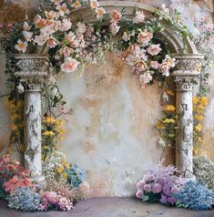 a painting of flowers on a wall with an arch in the middle and two columns at the end