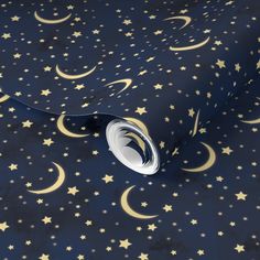 a night sky with gold stars and crescents on blue background, wrapping paper design