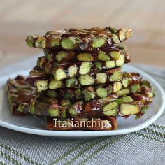 there are many pieces of food on the plate and one is stacked high with nuts