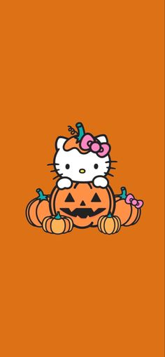 an orange background with a hello kitty pumpkin