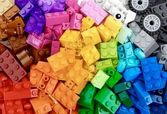 many different colored legos are stacked together