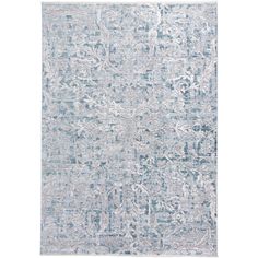 a blue and white rug with an intricate design