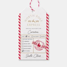 a red and white striped gift tag with the north pole express logo on it, hanging from a string