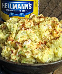 a bowl filled with mashed potatoes next to a jar of mayonnaise