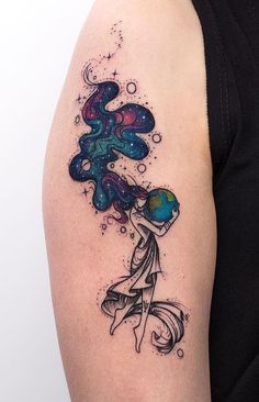 a woman's arm with an abstract tattoo design on the left side of her body