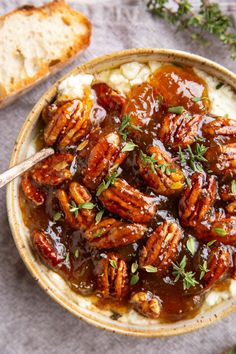 a bowl filled with mashed potatoes and pecans