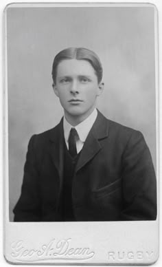 an old black and white photo of a man in a suit