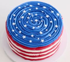 a red, white and blue cake sitting on top of a plate