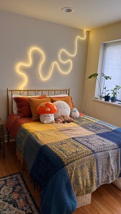 cozy bedroom, boho, colorful, stuffed animals, lights, plants, boho apartment Bedroom Ideas Stuffed Animals, Aesthetic Simple Bedroom Ideas, Neon Lights Aesthetic Bedroom, Fun Bedroom Lighting, Colorful Simple Bedroom, Boho College Apartment Bedroom, Stuffed Animals Bedroom, Neon Boho Bedroom, Simple Boho Bedroom Ideas