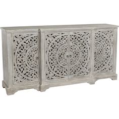 an ornate carved sideboard with four doors and three drawers, in whitewashed wood