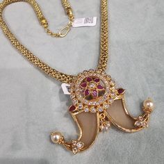 All our pieces are in stock with us in Atlanta, USA and will be dispatched within 24 to 48 hours of order. Orders received during the weekend will be dispatched on Monday. We have a huge Silver Jewelry collection with us, Necklace sets, Bangles and Bracelets Earrings, Fushion Jewelry, Hasli, Tikka, Vaddanam, Vanki , Rings, Anklets,Toe Rings and Precious beads collection made with Kundans, Mossonites, Cz diamonds, Swarovski , Victorian , Corals. Pls contact us for more designs, we will be happy to ship from Atlanta.  For Further Details/ Questions , please contact us on Whatsapp 8434607230 or Reach out to us on Etsy messages.  Sold as a set: Pendant and Chain Material : Pure 92.5 Silver Pendant Stones: Czs Gemstone :  Swarovski Pearls, Primary color : Gold JEWELRY CARE:  1. To maintain the Reach Out, Nails Pendant, Atlanta Usa, Beads Collection, Bangles And Bracelets, Precious Beads, Necklace Sets, Swarovski Pearls, Cz Diamond