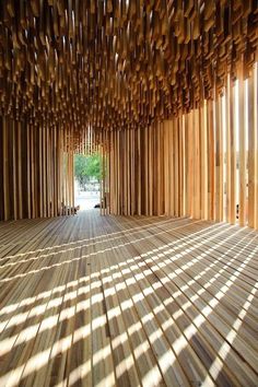 an empty room with wooden slats covering the floor