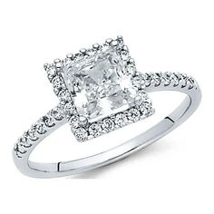 an engagement ring with a princess cut diamond in the center and pave set shoulders