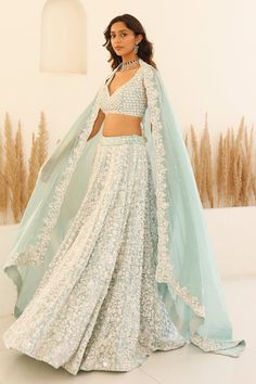 Blue can can attached lehenga featuring sequin and bead embroidered floral blossom motifs and pearl detailing. Comes with padded embroidered blouse and scalloped border dupatta. - Aza Fashions Aqua Blue Lehenga, Pretty Lehengas, Sequinned Lehenga, Floral Bridal Lehenga, Studio Iris, Indian Wedding Aesthetic, Sangeet Lehenga, Ethereal Elegance, Desi Dress