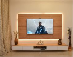 a flat screen tv mounted to the side of a wall