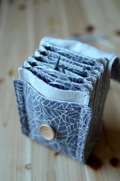 an open wallet sitting on top of a wooden table