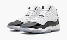 The Air Jordan 11 GS “Concord 2018” is the grade school-sized release of one of the most important sneakers of all time.  This retro features the beloved design in its most accurate form since the original that Michael Jordan wore on court in 1996.  The Air Jordan 11 GS “Concord 2018” features the same white ballistic mesh and leather upper with shining black patent leather construction as the men’s sizing.  The kids’ Concord colorway also features “45” on each heel, referencing the original pai White Jordan 11, Air Jordan 11 Concord, Black And White Jordans, Jordan 11 Concord, All Jordans, White Jordans, Nike Air Jordan 11, Air Jordan 11 Retro, Womens Jordans