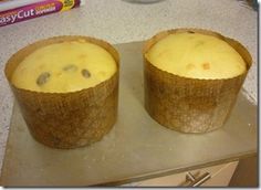 two muffins sitting on top of a counter