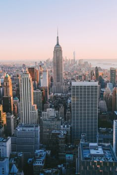 an aerial view of new york city at sunset