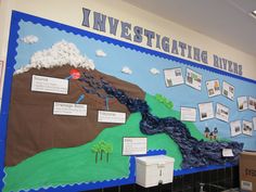 a bulletin board with information about investigating rivers and lakes on the wall in an elementary classroom