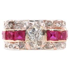 An Art Deco diamond, ruby, platinum, and rose gold ring, comprising one large old European cut diamond, sixteen smaller rose cut diamonds, and eight square and rectangular cut rubies, set in platinum, to a 14 karat rose gold band. This sensational ring is set to the centre with a round, old European cut diamond. The diamond is held within a platinum setting, enhancing the sparkle of the diamond. A row of square cut and rectangular cut rubies extends from the central diamond, held within a rose g Rose Gold Band, Small Rose, E 40, European Cut Diamonds, Art Deco Diamond, Ruby Diamond, Square Cut, Rose Cut Diamond, Gold Band