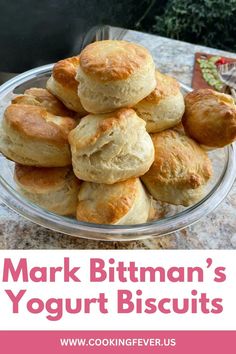 a pile of biscuits sitting on top of a glass plate with the words mark bitman's yogurt biscuits