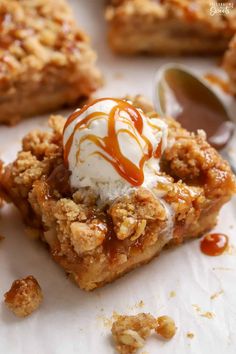 a piece of pie with ice cream and caramel drizzle on top