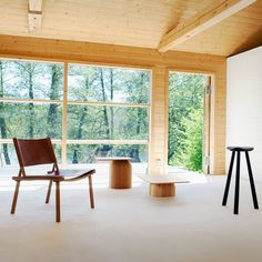 two chairs and a table in an empty room