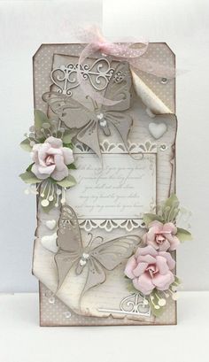 a card with flowers and butterflies on it