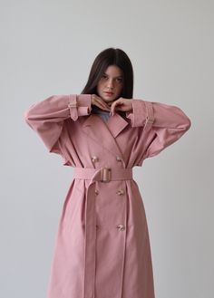 Pink trench coat for women, Relaxed trench coat with belt, Pink long cotton coat, Oversize classic trench coat for fall and spring A classic and timeless trench coat is a great addition to any wardrobe. It has ultimate versatility and pairs well with others. Our cotton pink trench is a slightly oversized classic cut with a vintage touch to it. Perfect for the fall-spring season. ■ color: pink View shop for other color options ■ material: Outer: 100% Cotton Lining: 100% Viscose ■ style: - relaxed Long Pink Coat Outfit, Belted Long Raincoat For Spring, Pink Trench Coat Outfit, Pink Coat Outfit, Long Pink Coat, Trenchcoat Outfit, Pink View, Long Cotton Coat, Coat For Fall