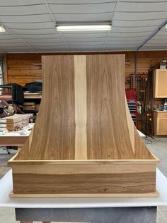 a large wooden object sitting on top of a table