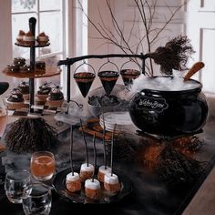 a table topped with lots of desserts and drinks