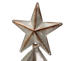 a metal star decoration on a white background