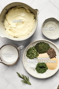 ingredients for homemade ranch seasoning laid out on a white counter top, including carrots, chives and mayo