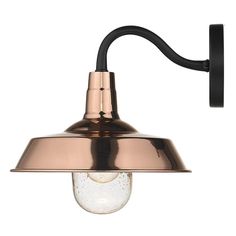 a copper and black wall light with a white background