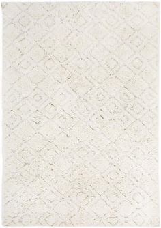 a white rug with diamond shapes on it