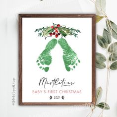 a baby's first christmas card with the word merry written in green and red