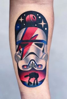 a star wars tattoo on the leg of a person with a helmet and stars in the background