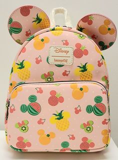 PLEASE READ: I believe this bag has a flaw. If you look at the pictures of the front of the bag, it appears that the pocket was sewn on crooked. Other than that, the bag is brand new with the original tags. This Loungefly Disney Mickey & Minnie Mouse Fruit Heads Ears Mini Backpack is a must-have for any Disney lover. It features a fun fruit pattern with Mickey and Minnie Mouse characters. The bag has a zip closure and a top handle for easy carrying. The exterior is made of faux leather and polyu Mickey Mouse Fruit, Disney Bags Backpacks, Cute Mini Backpacks, Mini Mochila, Loungefly Bag, Disney Bag, Mickey Mouse Ears, Loungefly Disney, Girl Decor