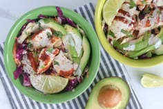 two green bowls filled with food next to an avocado