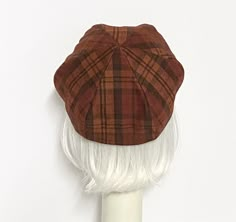 "Rust plaid vintage upcycled wool blend beret hat, lined in rayon print, the top of the hat is made up of 6 section crown, wool bias 1\" fitted band and !' soft elastic band inside. One size fits most up to a 22\" head size Made in the USA Machine wash cold / hand dry" Adjustable Wool Beret For Fall, Fitted Wool Beret With Short Brim, Classic Fitted Beret With Curved Brim, Classic Fitted Beret With Short Brim, Adjustable Plaid Flat Cap, Brown Fitted Flat Cap, Fitted Brown Flat Cap, Fall Beret With Curved Brim, One Size, Fitted Fall Cap