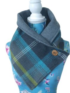 Feast your eyes on this elegant neck warmer! Handmade from a gorgeous wool touch tartan check fabric and lined with a plain grey fleece. Ready for those cold wintery days, this neck warmer is an excellent addition to a ladies wardrobe. Soft fleece lining on the neck gives this a chic warm look. It fastens with a coconut wooden button. Due to the colours this could be worn with creams, denims, blues, greys, lemons, blacks, etc, to give a classy and smart look. The scarf measures approx 39 inches Classy Scarf, Fleece Sewing Projects, Sewing Scarves, Fleece Projects, Crochet Neck Warmer, Neck Warmers, Check Scarf, Sewing Fleece, Tartan Scarf