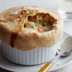 a white plate topped with a pot pie