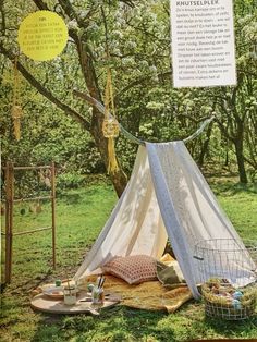 an image of a tent set up in the grass