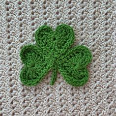 a crocheted shamrock is laying on the ground